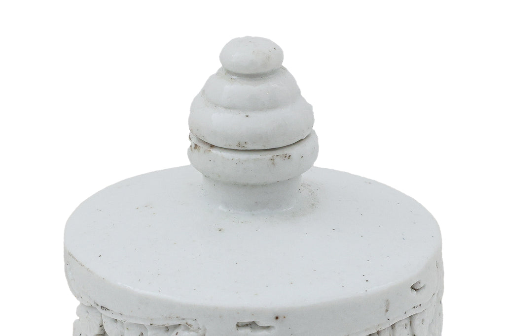 A SMALL WHITE GLAZED PORCELAIN BOTTLE