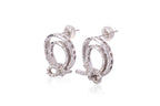 A PAIR OF DIAMOND SET CIRCULAR 'KNOT' EARRINGS