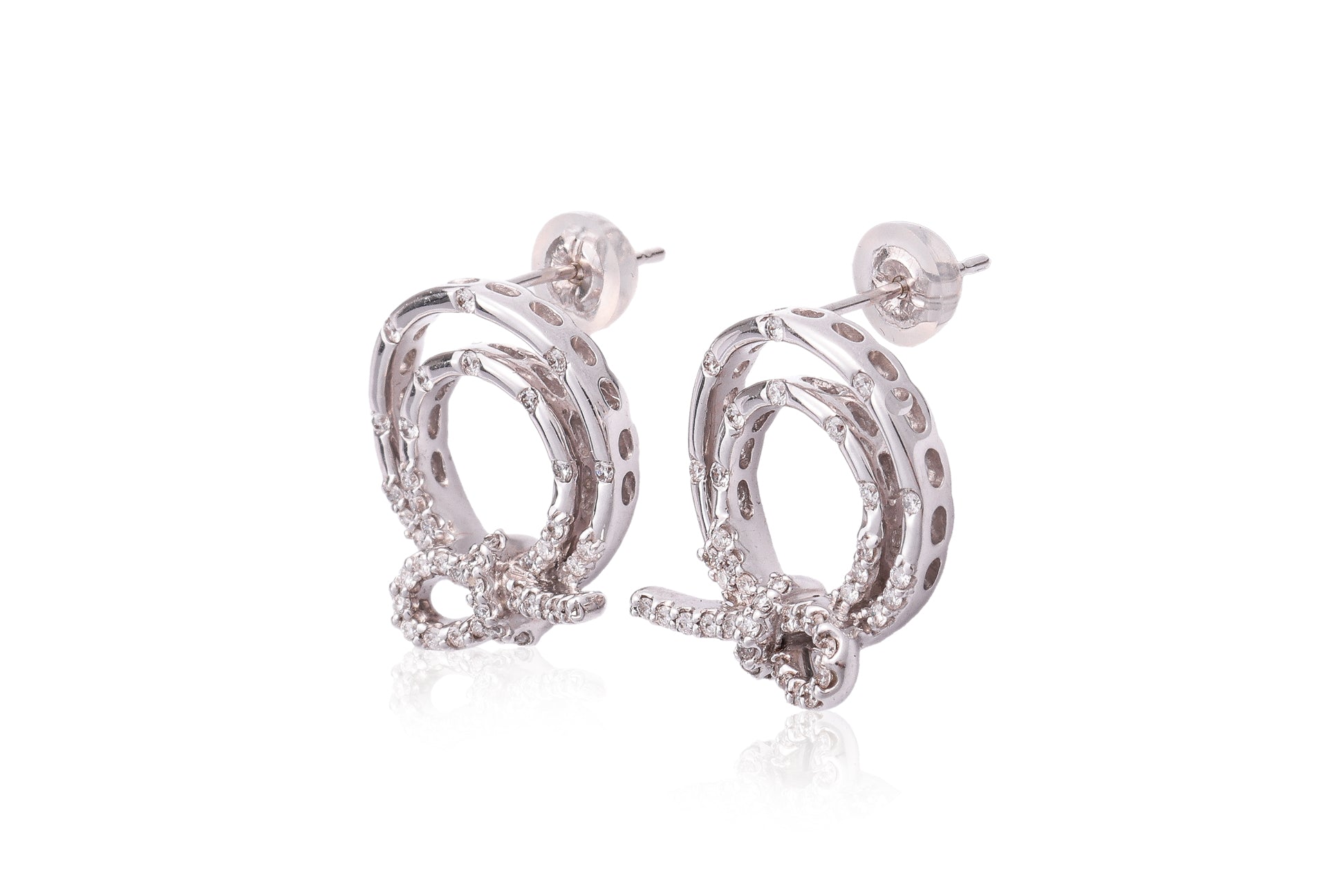 A PAIR OF DIAMOND SET CIRCULAR 'KNOT' EARRINGS