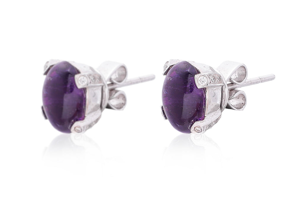 AN AMETHYST AND DIAMOND RING WITH MATCHING EARRINGS