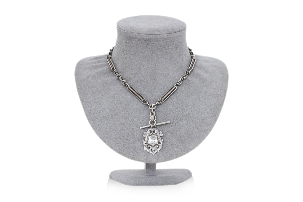 A GROUP OF THREE PIECES OF ANTIQUE SILVER JEWELLERY