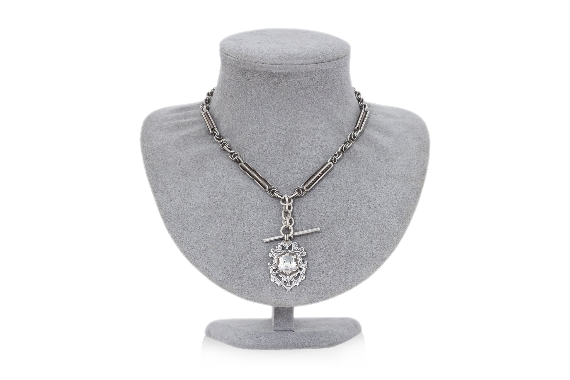 A GROUP OF THREE PIECES OF ANTIQUE SILVER JEWELLERY