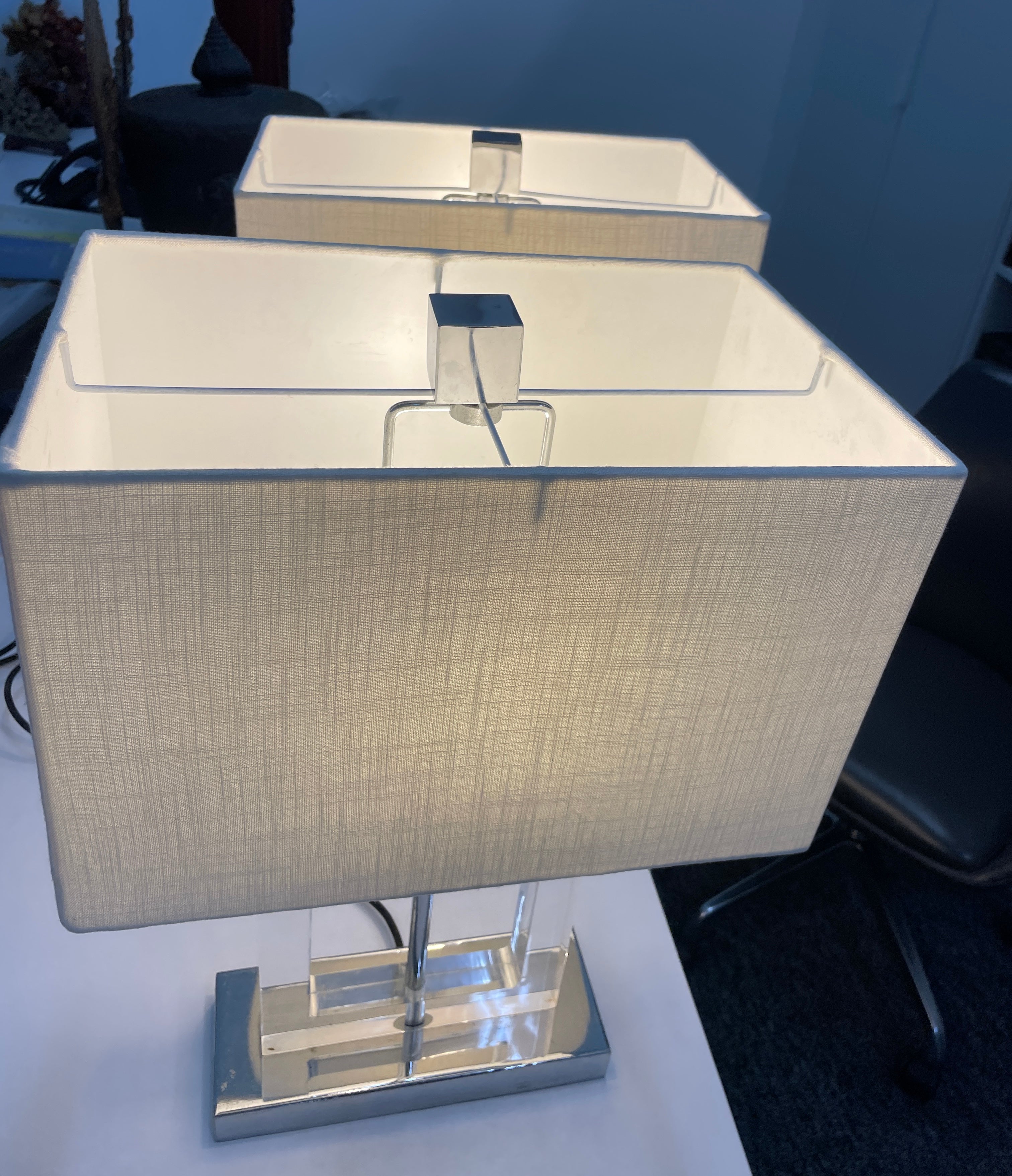 A PAIR OF CONTEMPORARY ACRYLIC AND CHROME PLATED TABLE LAMPS