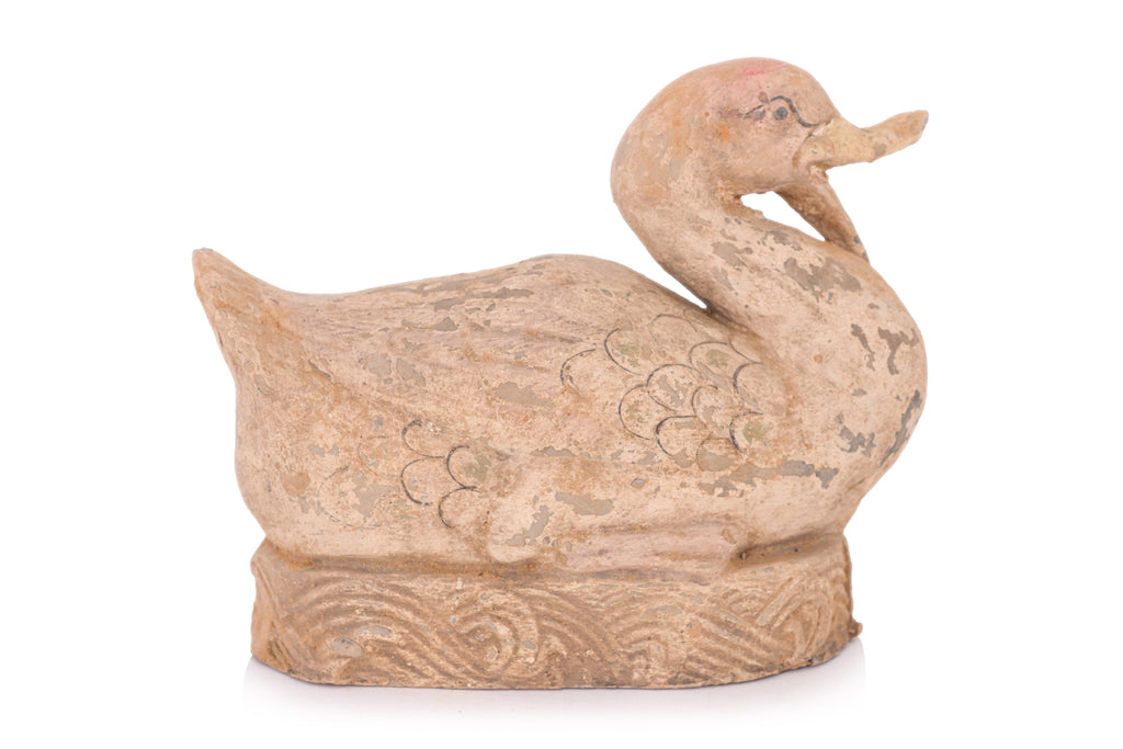 A PAINTED POTTERY MODEL OF A DUCK