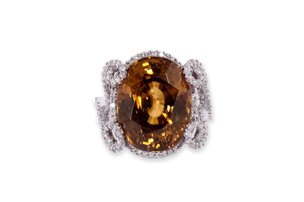 A LARGE ZIRCON AND DIAMOND RING