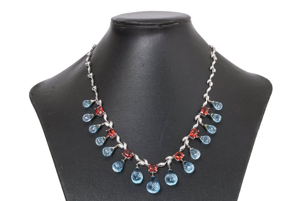A BLUE TOPAZ, GARNET AND DIAMOND NECKLACE