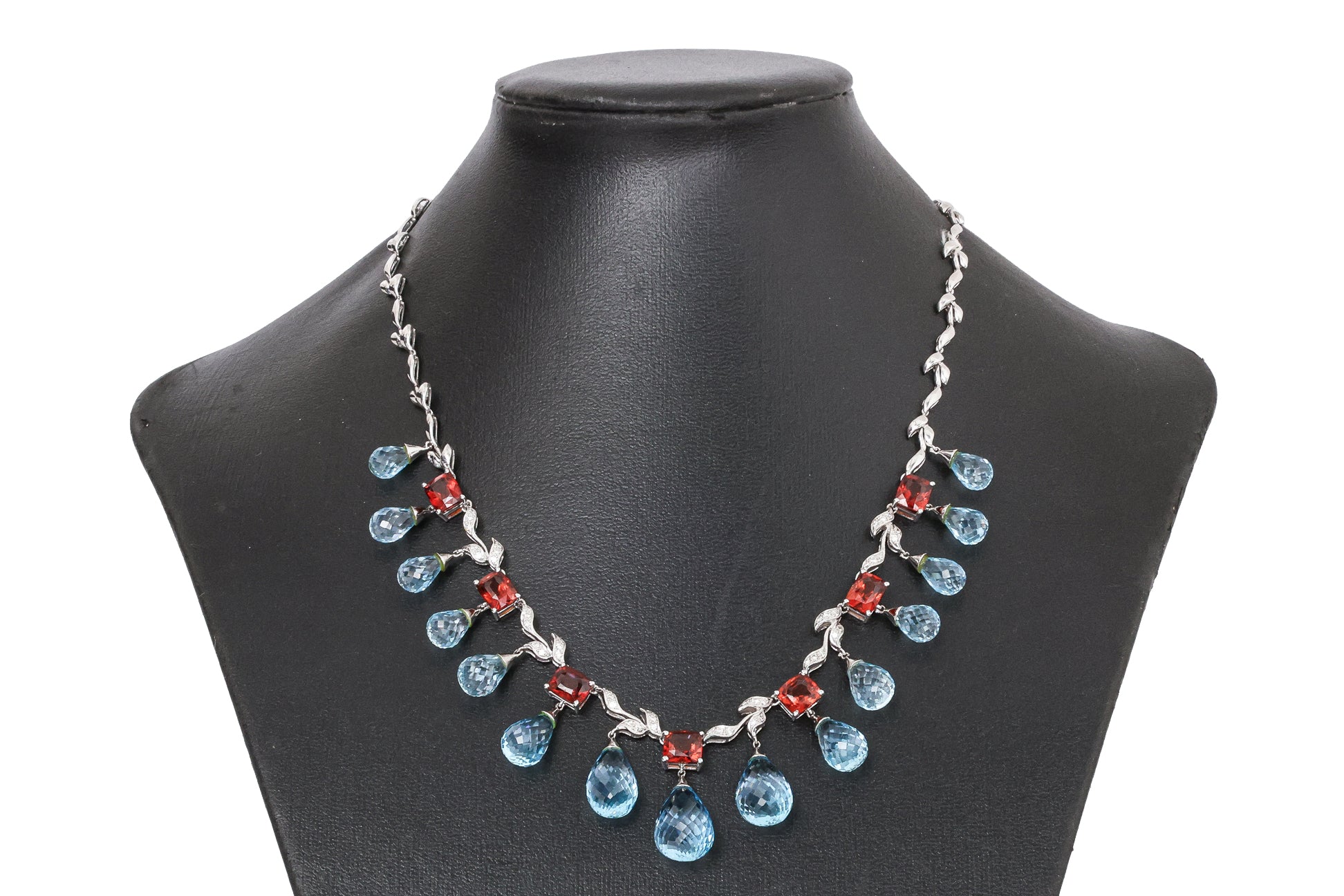 A BLUE TOPAZ, GARNET AND DIAMOND NECKLACE