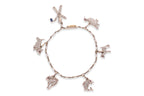 A CHARM BRACELET WITH ANIMAL AND FIGURATIVE CHARMS