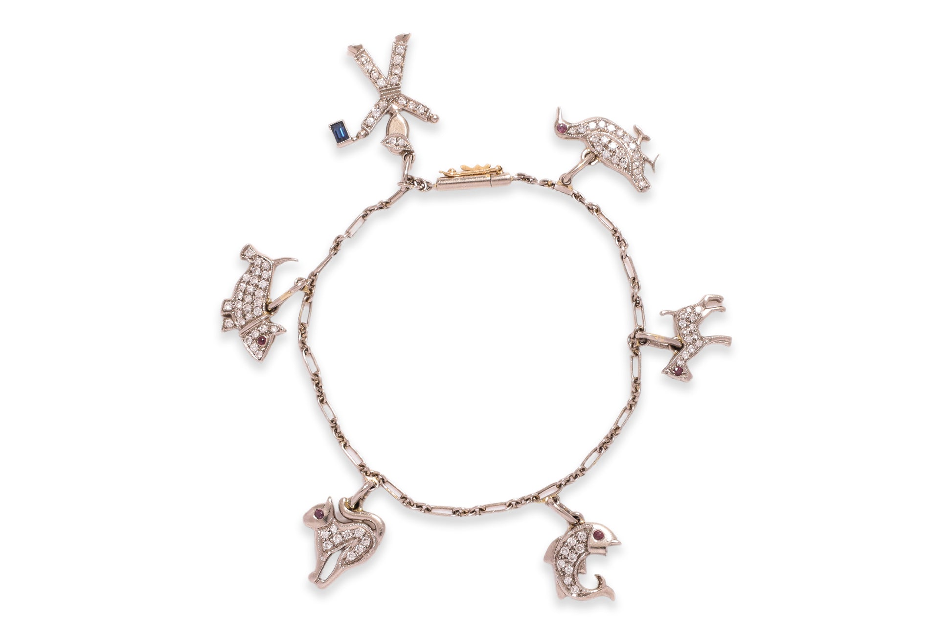 A CHARM BRACELET WITH ANIMAL AND FIGURATIVE CHARMS