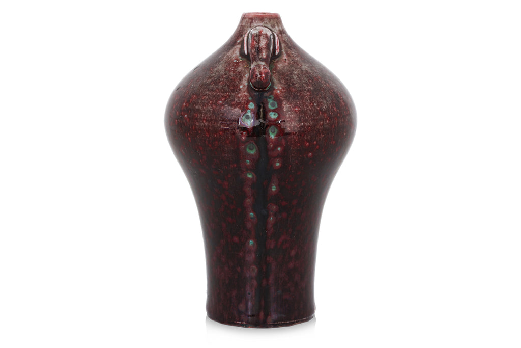 A FLAMBE VASE WITH ELEPHANT LUGS