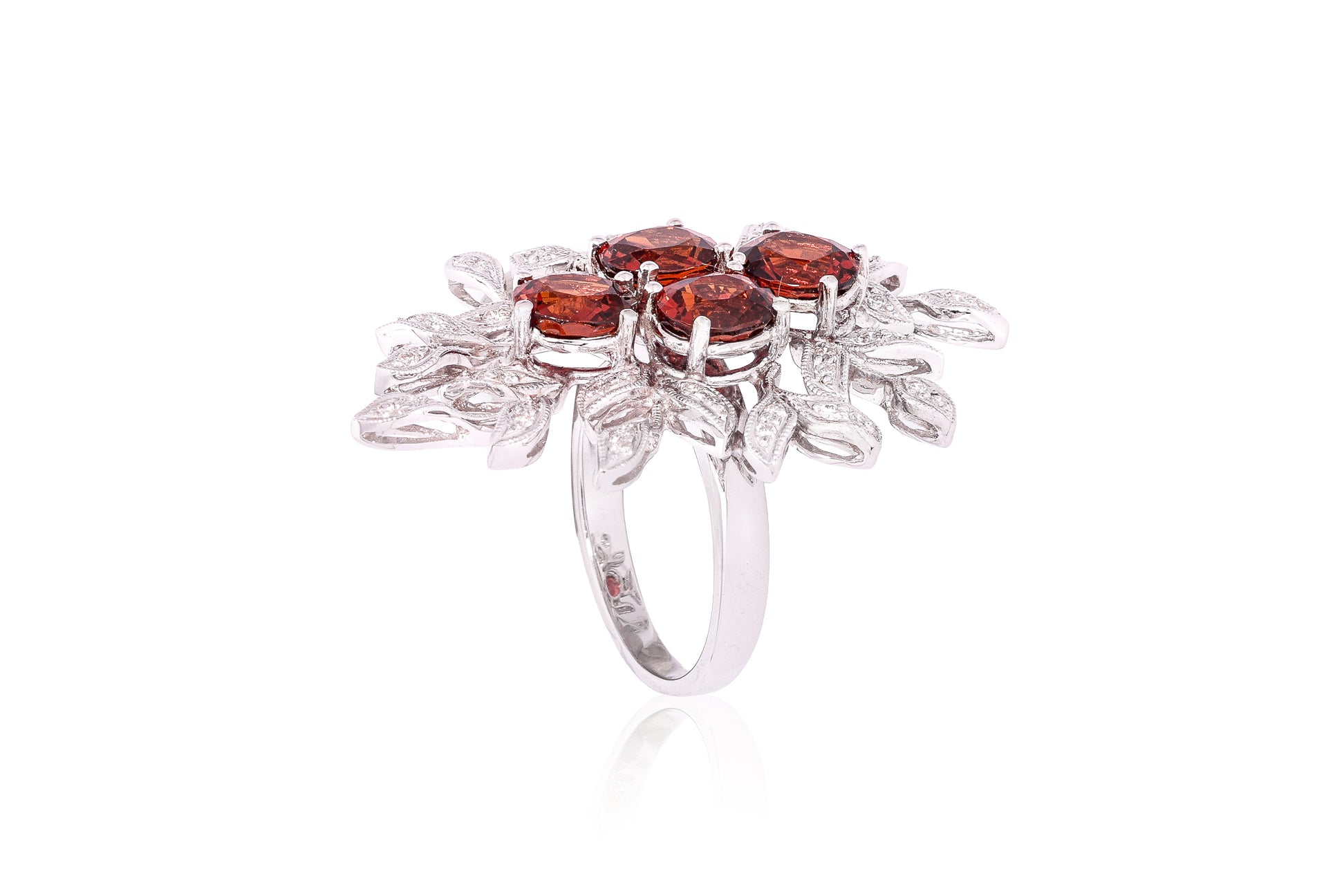 A GARNET AND DIAMOND 'BOUQUET' RING