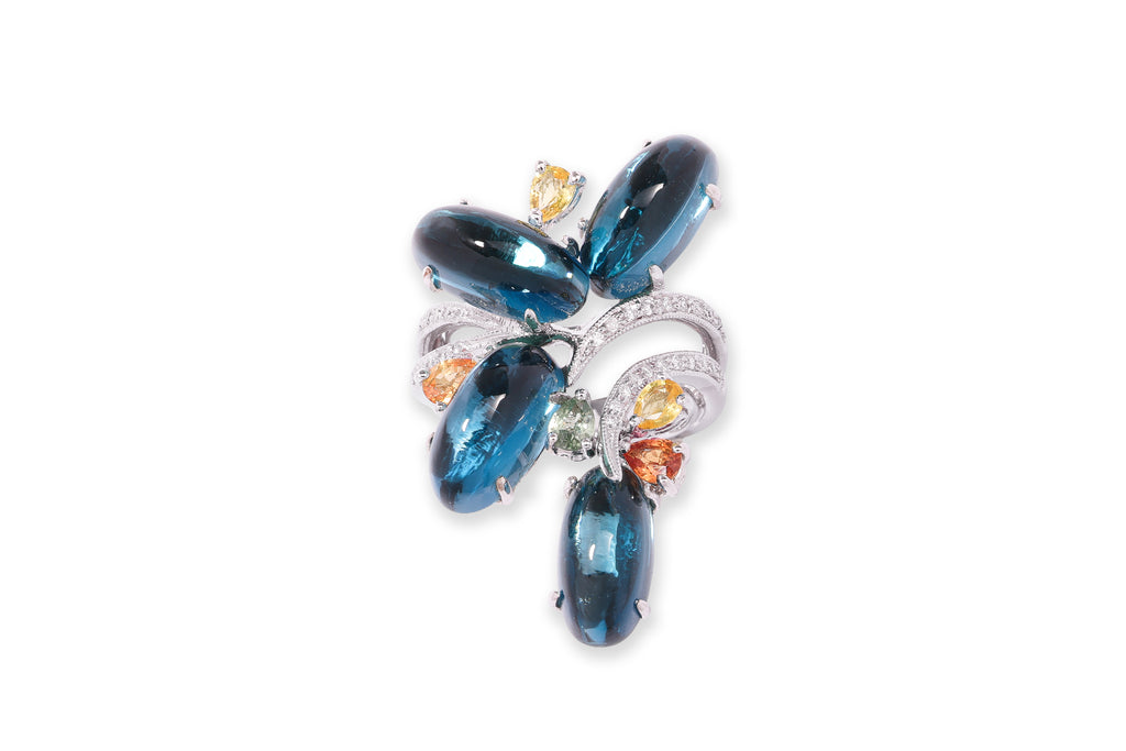 A BLUE TOPAZ, SAPPHIRE AND DIAMOND RING