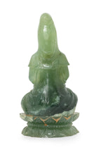 A SERPENTINE JADE FIGURE OF GUAN YIN