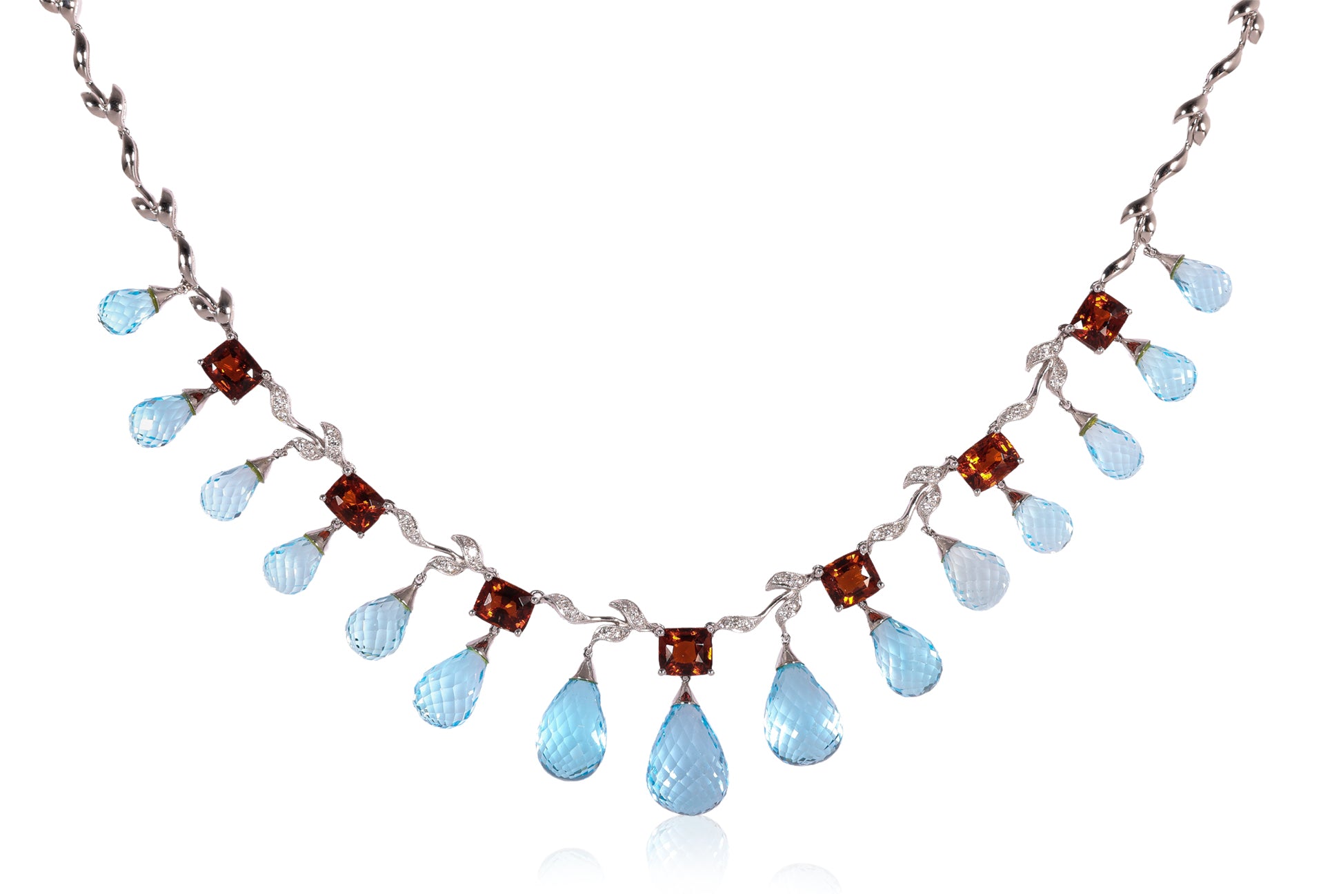 A BLUE TOPAZ, GARNET AND DIAMOND NECKLACE