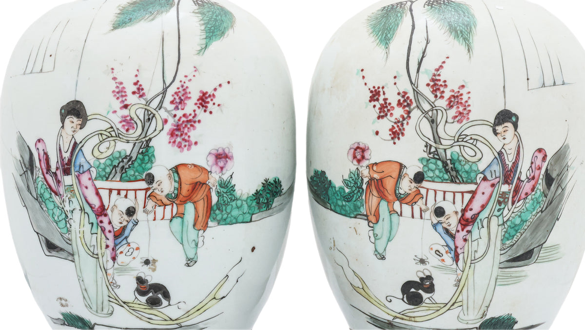 A PAIR OF FAMILLE ROSE JAR AND COVERS