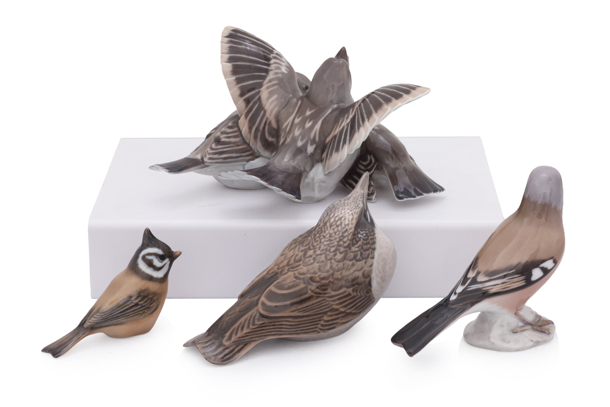 A GROUP OF FOUR ROYAL COPENHAGEN AND BING & GRONDAHL PORCELAIN BIRDS