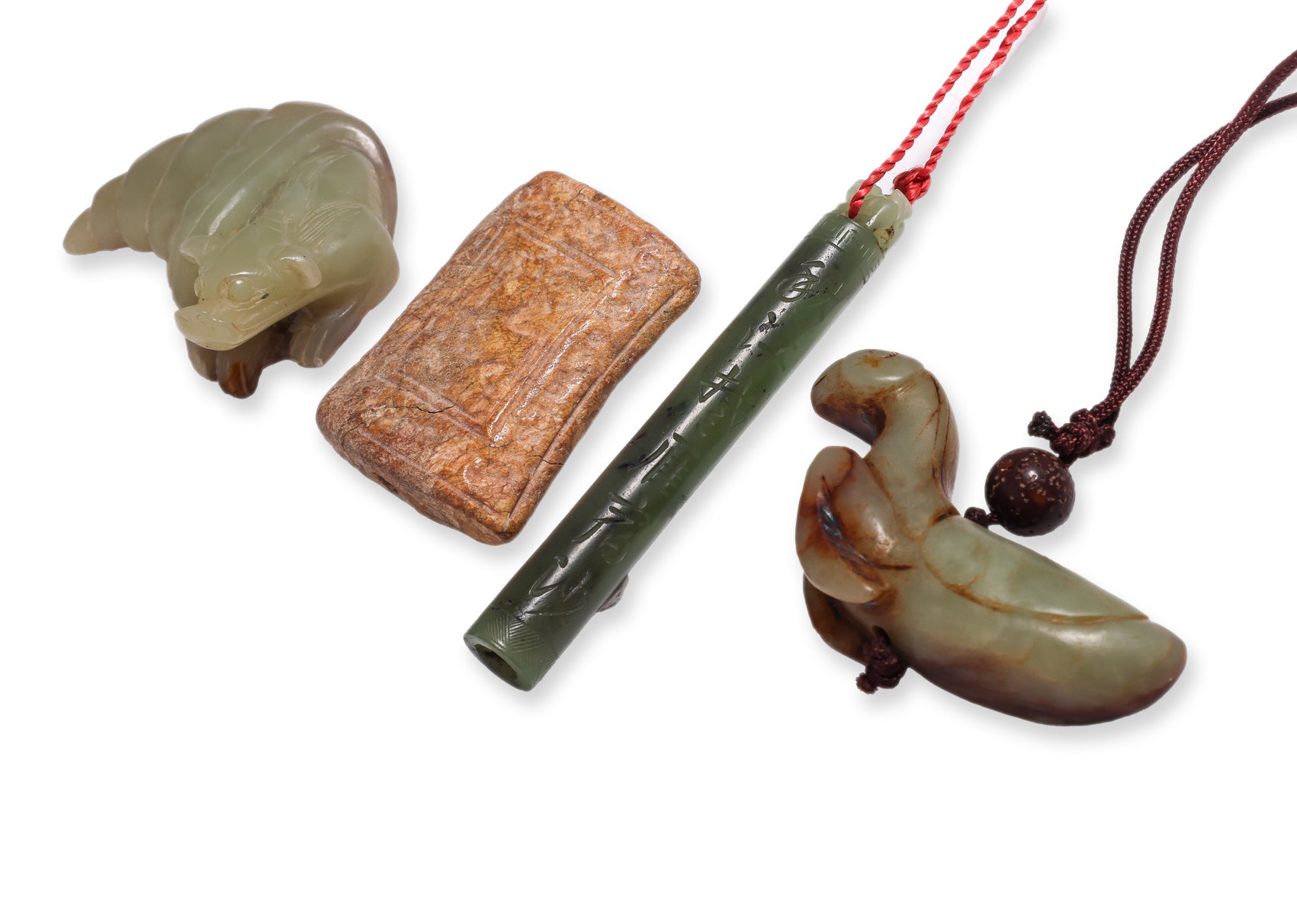 A GROUP OF FOUR JADE CARVINGS