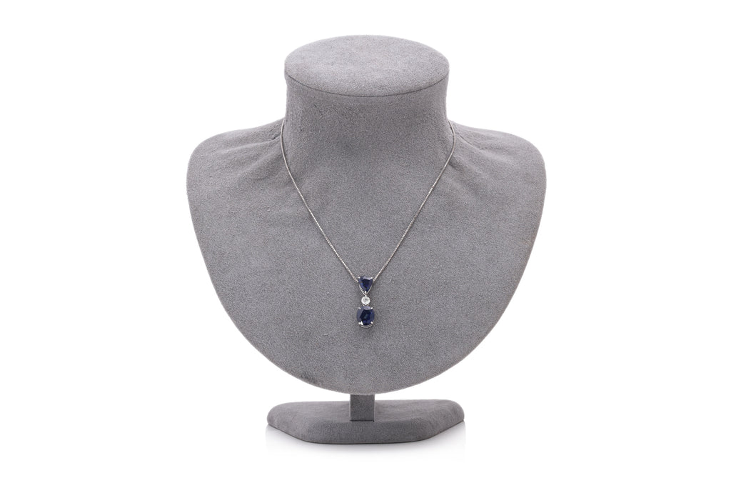 A BLUE SAPPHIRE AND DIAMOND PENDANT ON CHAIN