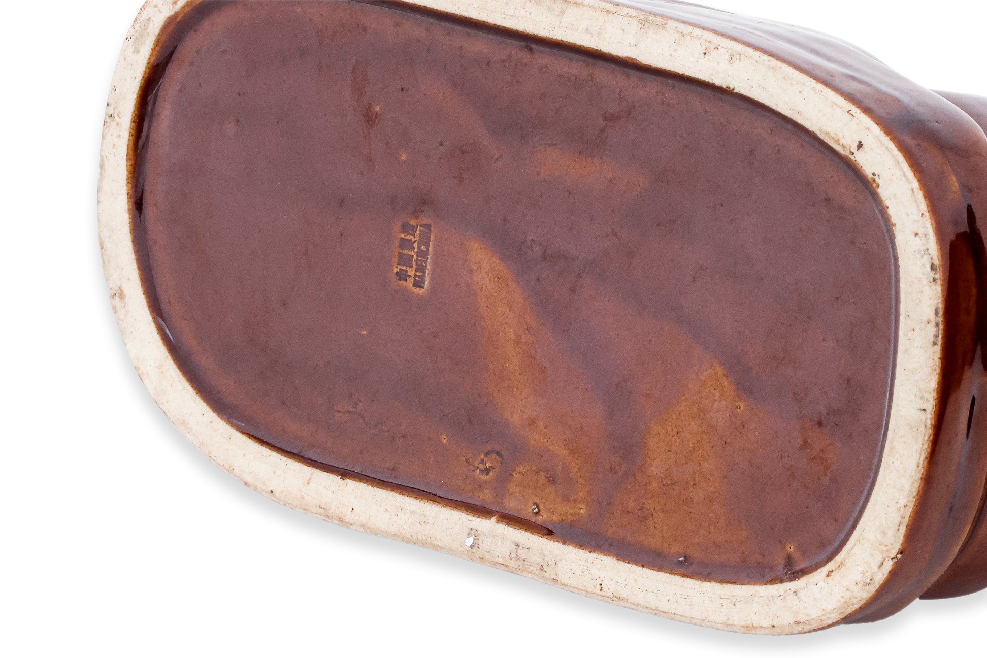 A GROUP OF THREE BROWN GLAZED CERAMIC PILLOW MONEY BOXES