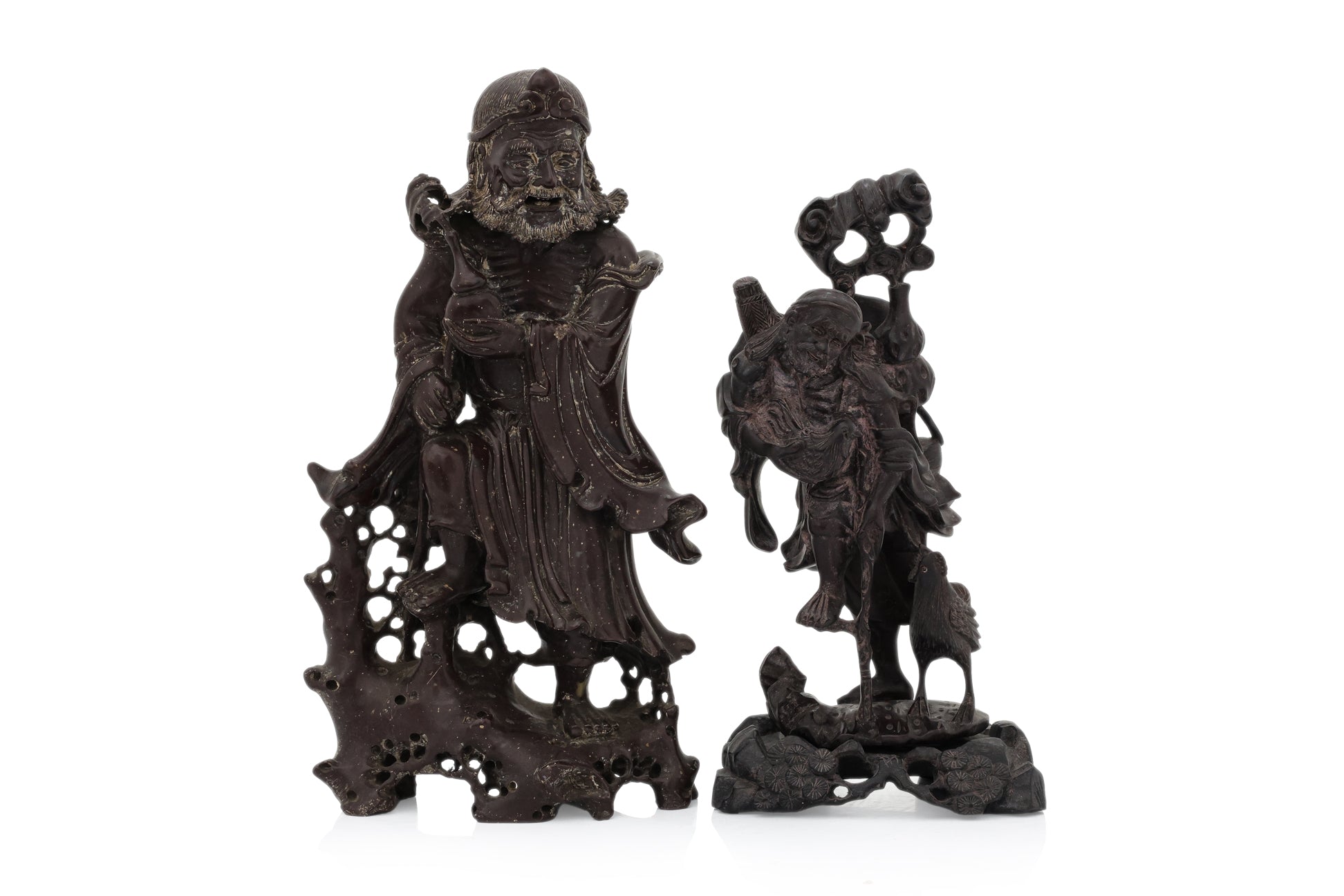 A SOAPSTONE AND A HARDWOOD CARVED FIGURE OF A MONK