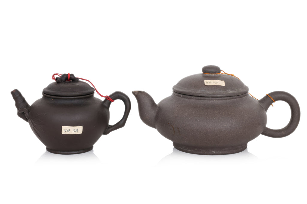 A GROUP OF THREE YIXING POTTERY TEAPOTS