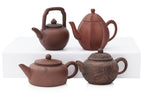 A GROUP OF EIGHT YIXING ZISHA POTTERY TEAPOTS