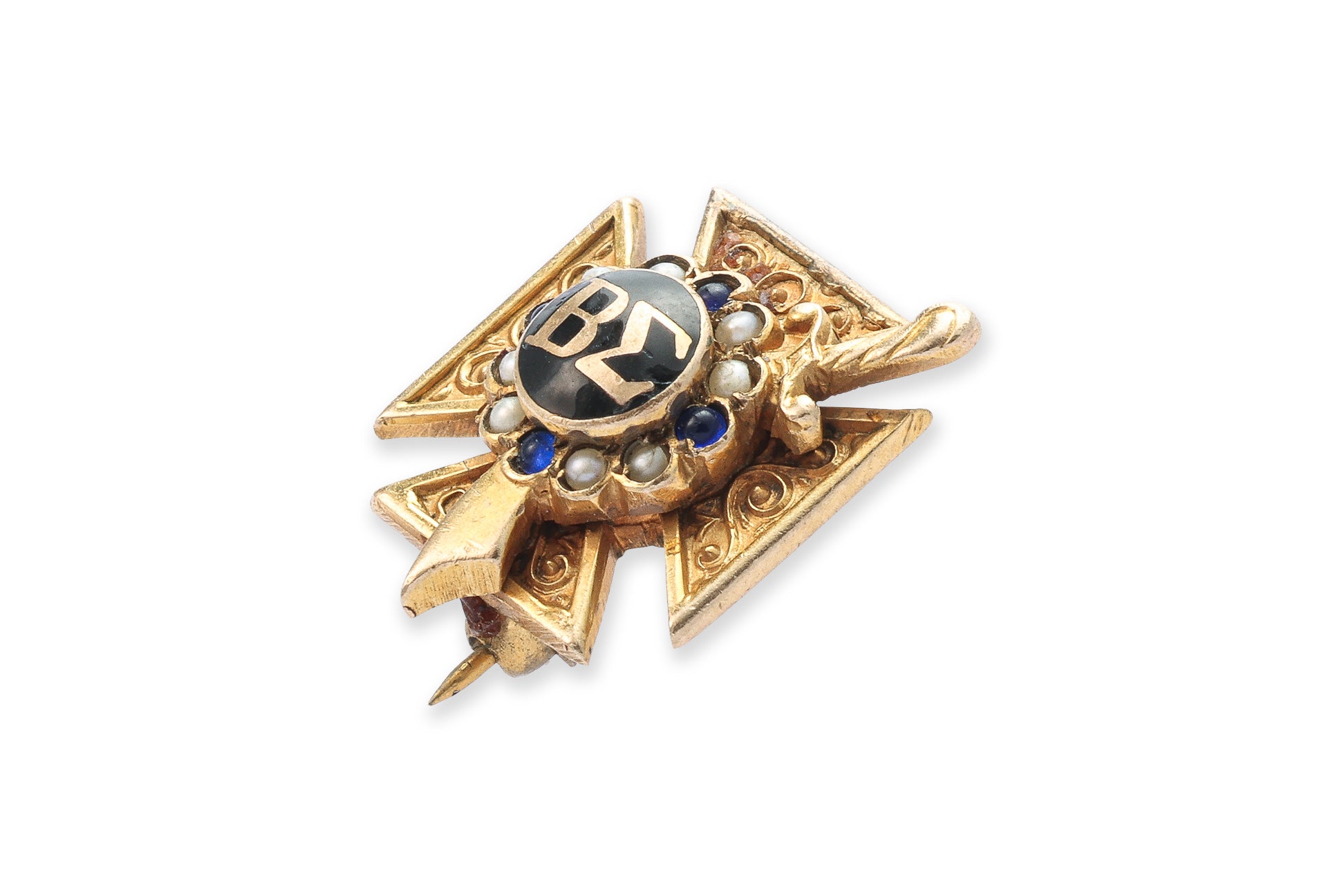 A GOLD SORORITY BADGE