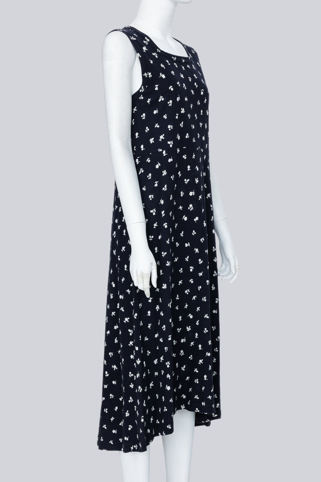 COMME DES GARCONS - A NAVY DRESS WITH A WHITE FLORAL PATTERN