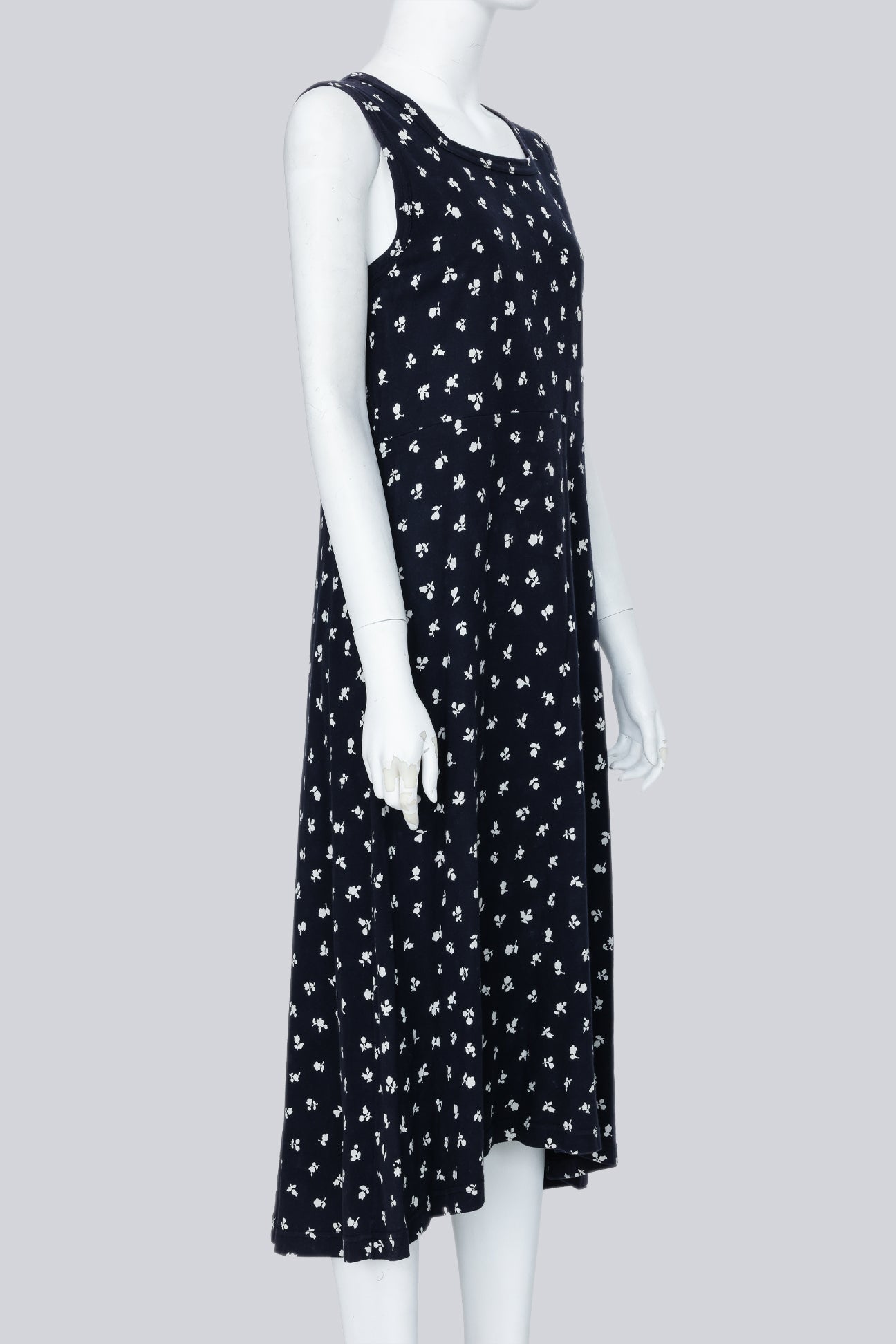 COMME DES GARCONS - A NAVY DRESS WITH A WHITE FLORAL PATTERN