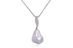 A LARGE BAROQUE SOUTH SEA PEARL AND DIAMOND PENDANT ON CHAIN