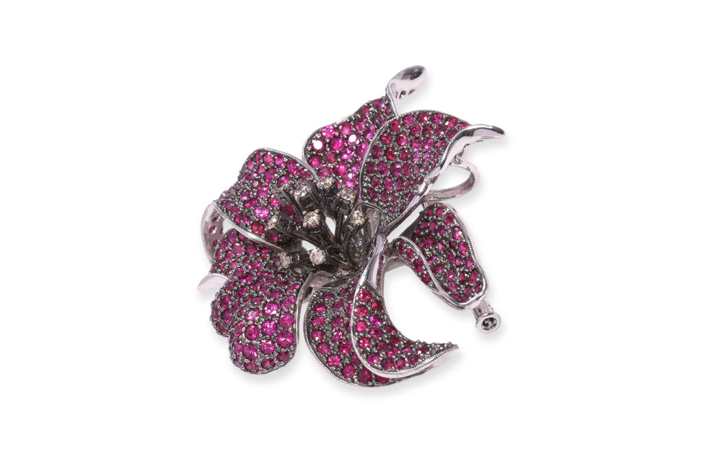 A RUBY AND DIAMOND STYLIZED 'ORCHID' BROOCH