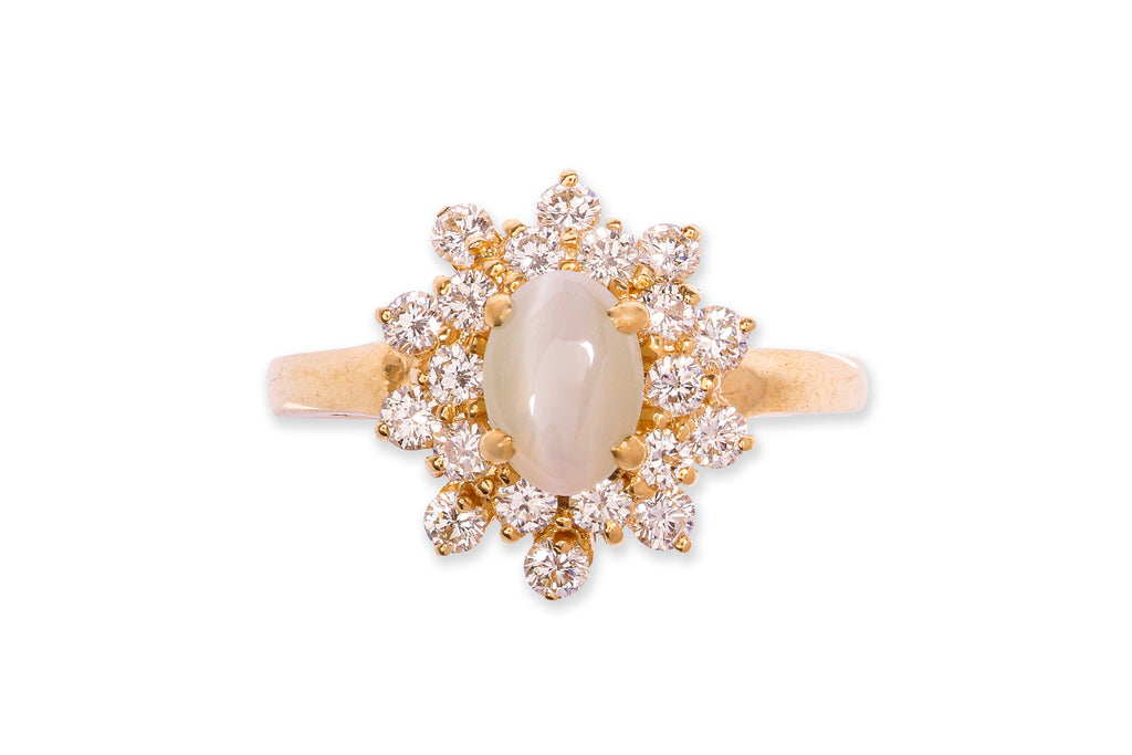 A CAT'S EYE CHRYSOBERYL AND DIAMOND RING