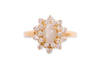 A CAT'S EYE CHRYSOBERYL AND DIAMOND RING