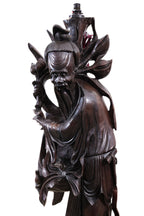 A VERY LARGE CHINESE CARVED HARDWOOD FIGURAL FLOOR LAMP