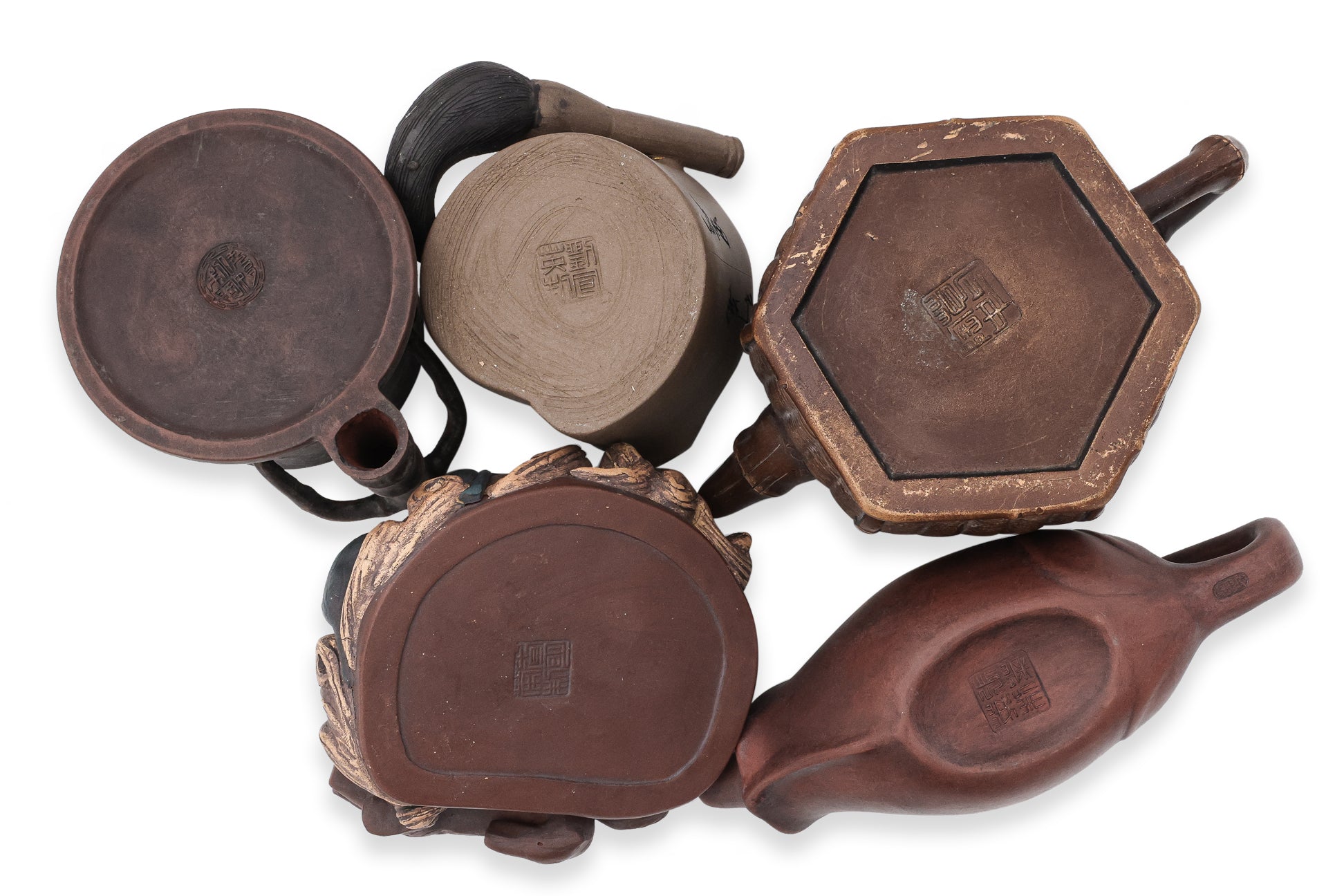 A GROUP OF FIVE YIXING ZISHA POTTERY TEAPOTS AND A BRUSH WASHER