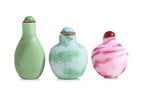 A GROUP OF THREE GLASS SNUFF BOTTLES (1)