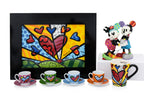 ROMERO BRITTO - A GROUP OF TABLEWARE, A DISNEY FIGURE, AND A PORCELAIN PLAQUE FOR GOEBEL