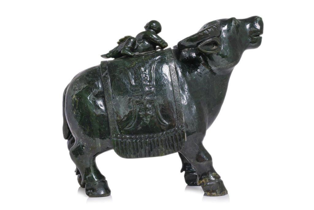 A LARGE SPINACH JADE BUFFALO AND BOY VESSEL