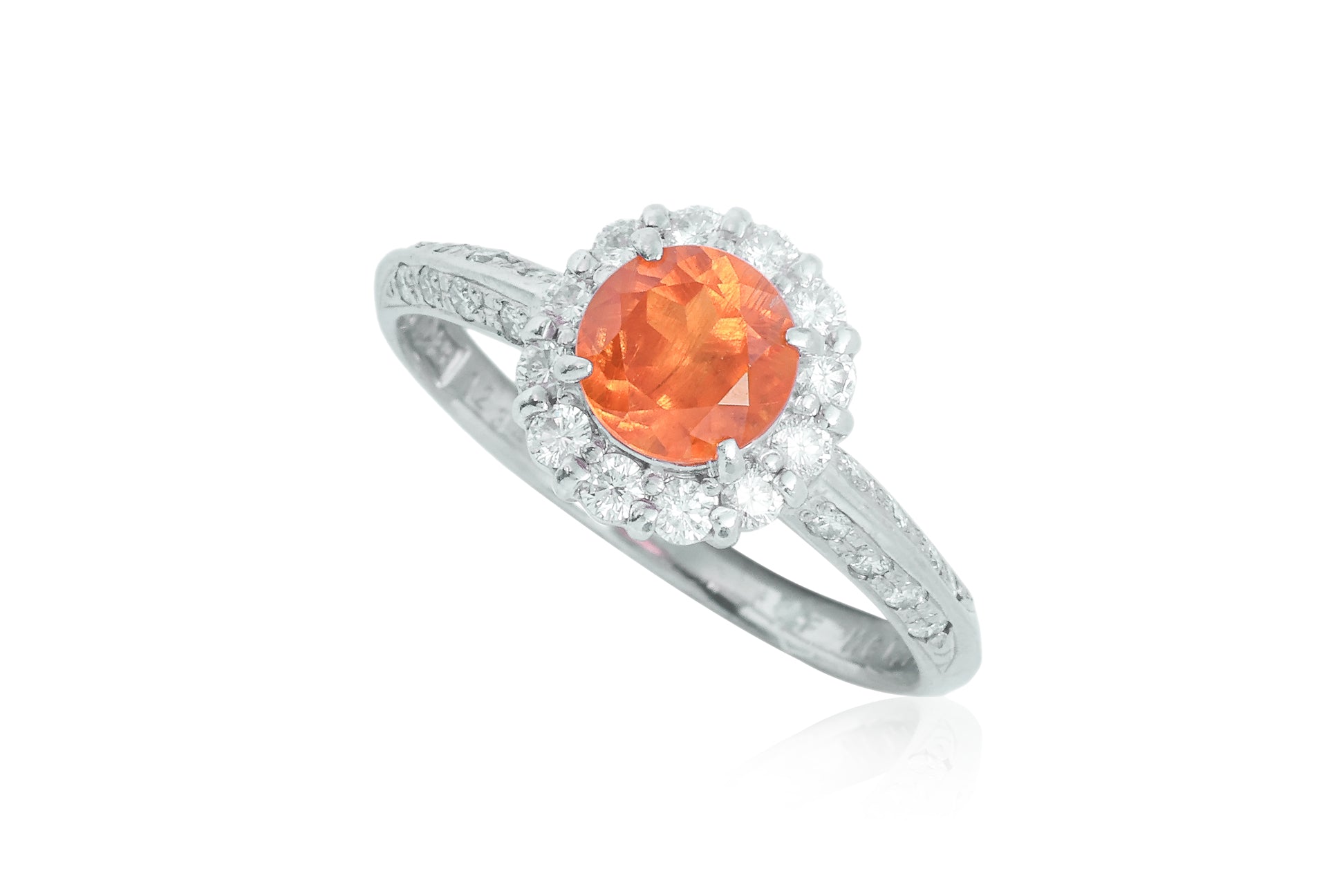 A SPESSARTITE GARNET AND DIAMOND RING BY SEIKO