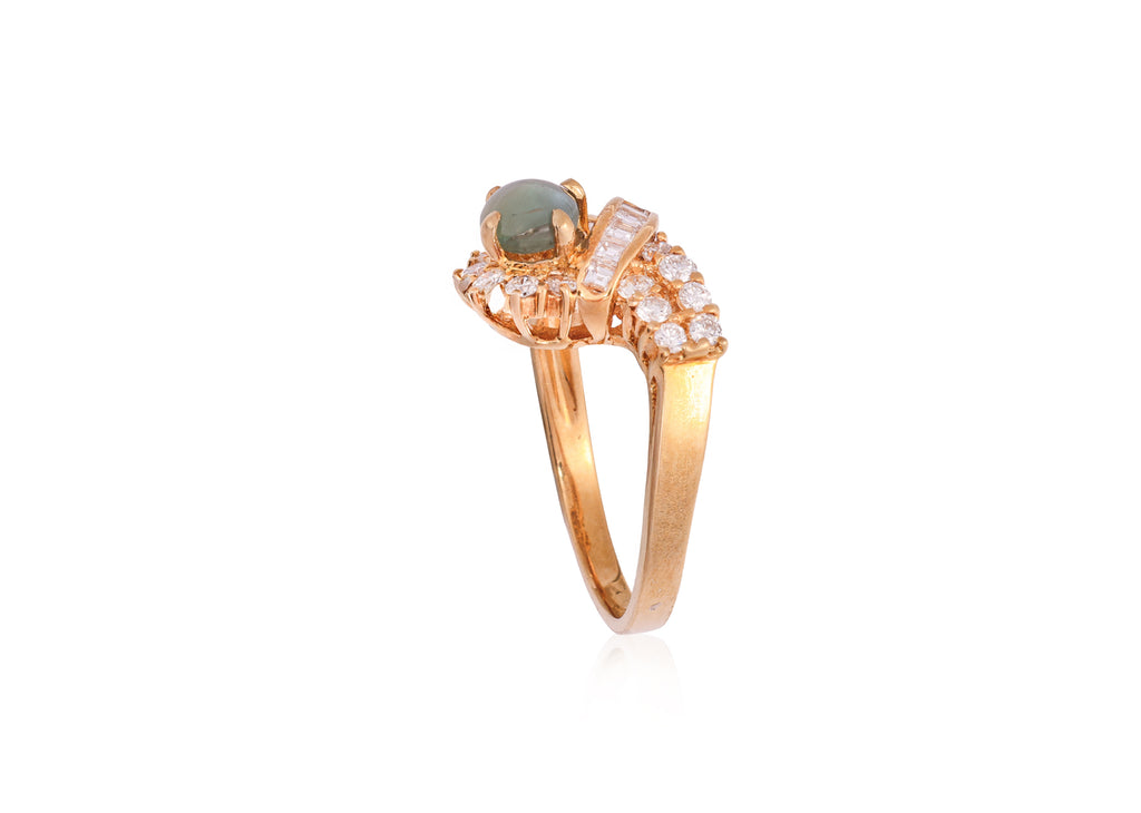 A CAT'S EYE CHRYSOBERYL AND DIAMOND RING