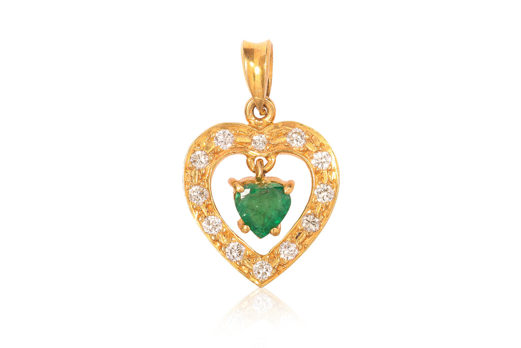 A HIGH KARAT GOLD EMERALD AND DIAMOND 'HEART' PENDANT