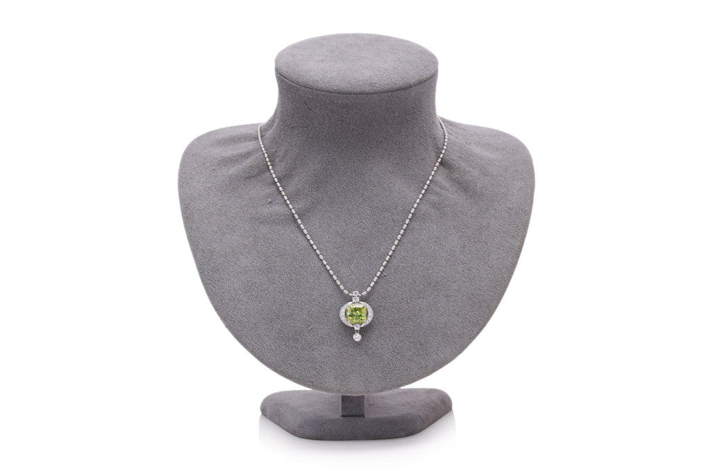 A SPHENE AND DIAMOND PENDANT ON CHAIN