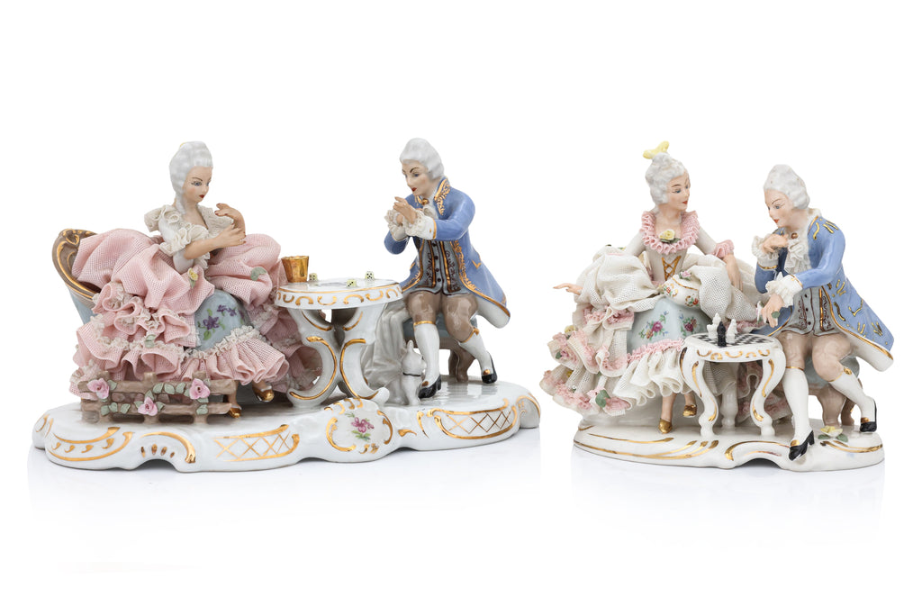 A GROUP OF FIVE GERMAN PORCELAIN FIGURES AND A CLOCK