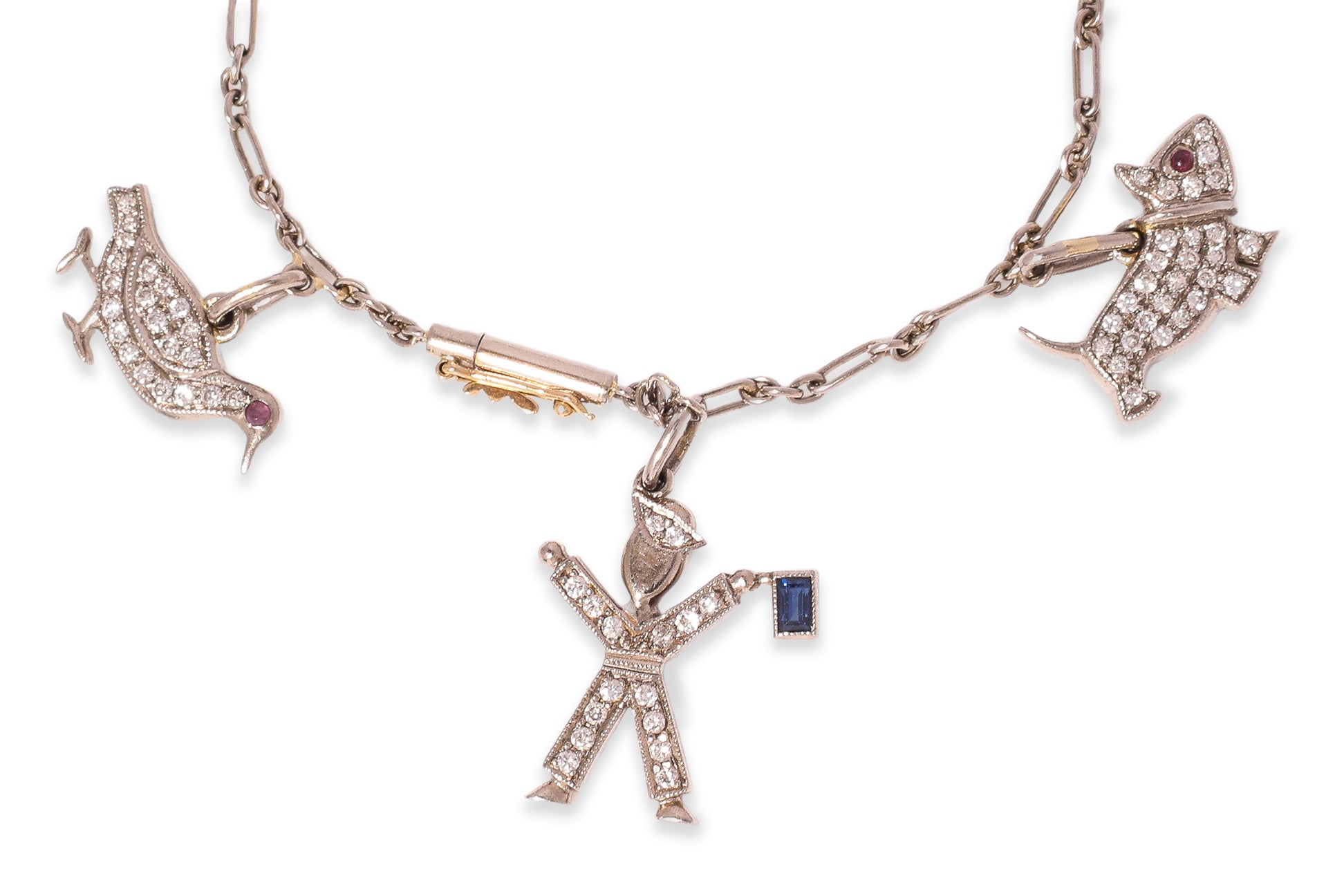 A CHARM BRACELET WITH ANIMAL AND FIGURATIVE CHARMS