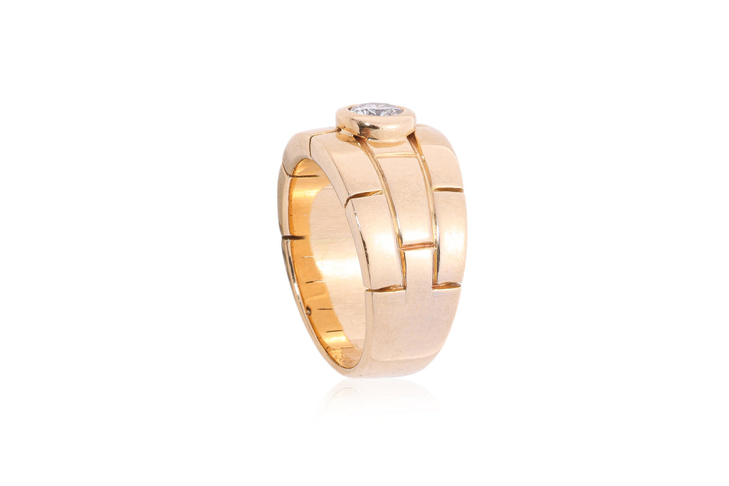 A PANTHERE SOLITAIRE RING BY CARTIER
