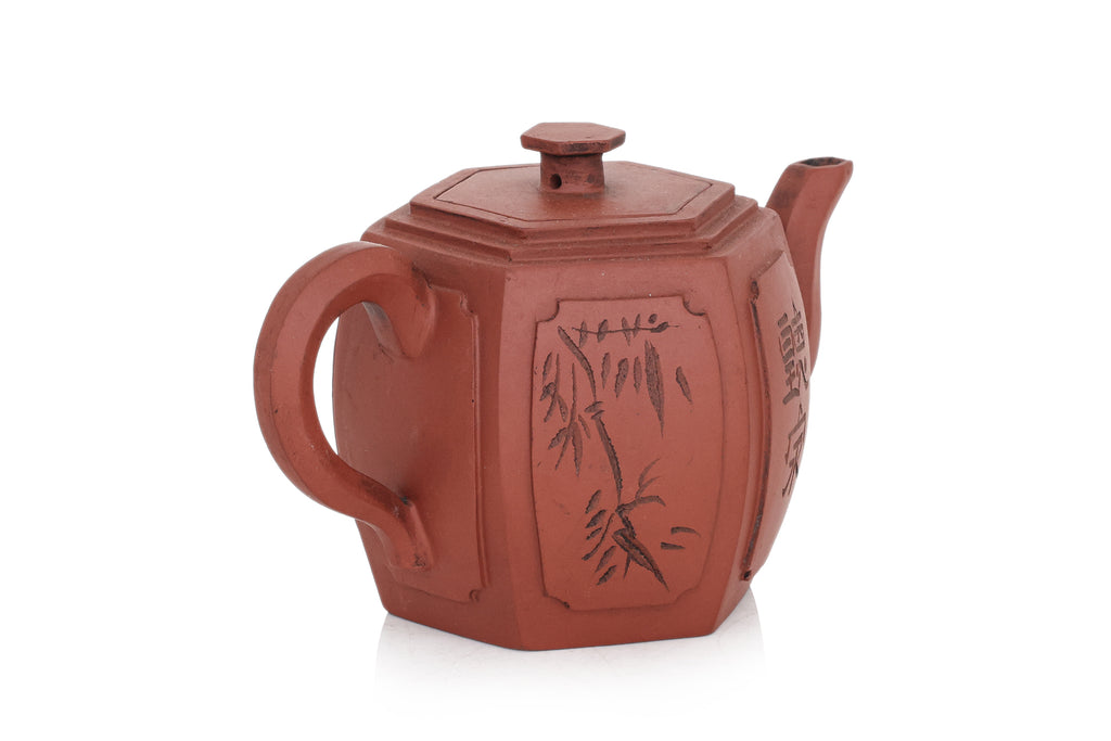 A YIXING POTTERY TEAPOT AND COVER