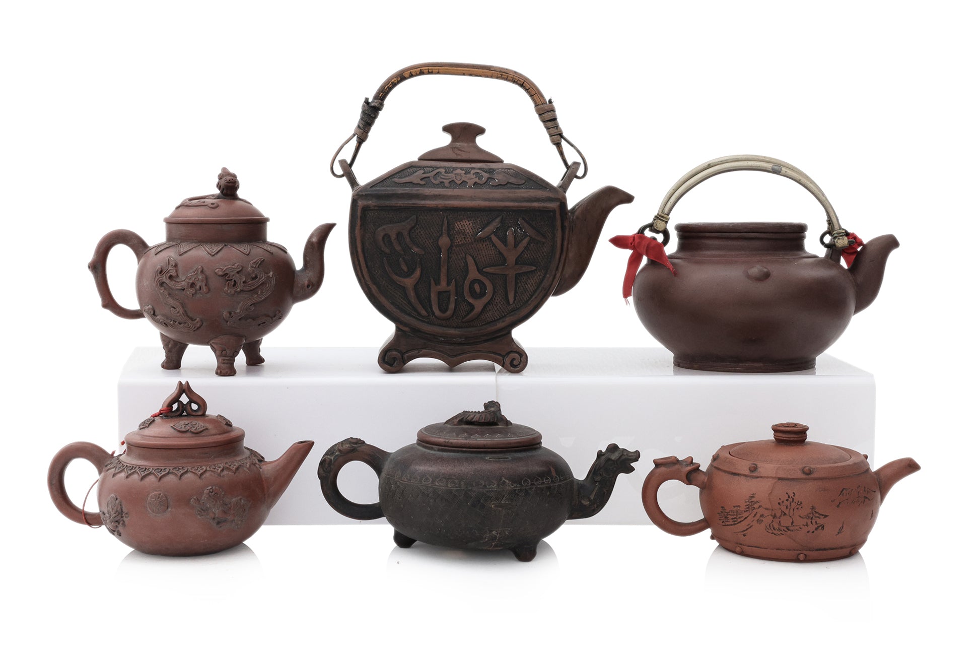 A GROUP OF SIX YIXING ZISHA POTTERY TEAPOTS