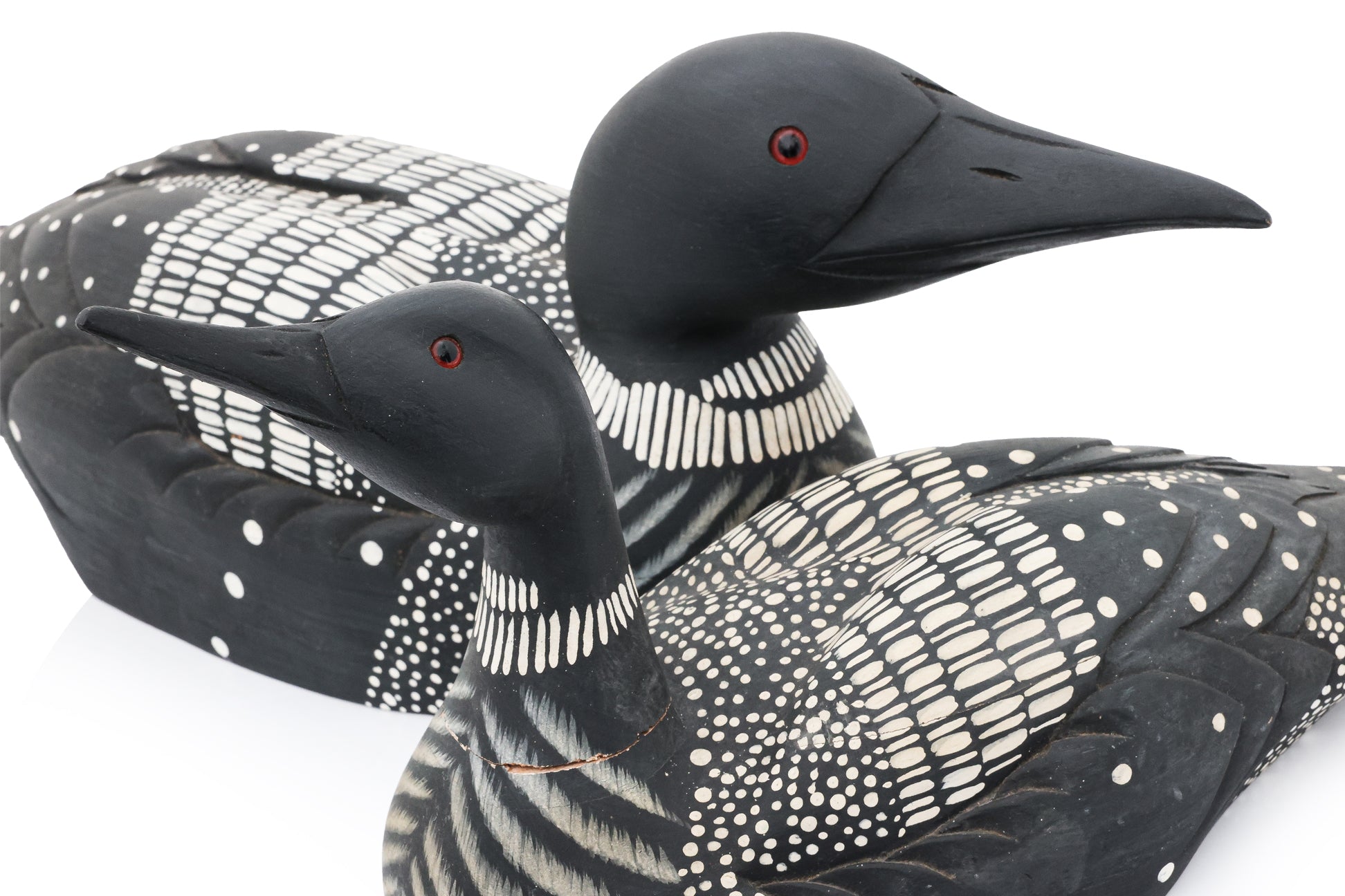 TWO CARVED AND PAINTED WOODEN DUCK DECOYS BY JAMES HADDON