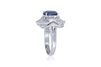 A SAPPHIRE AND DIAMOND CLUSTER RING
