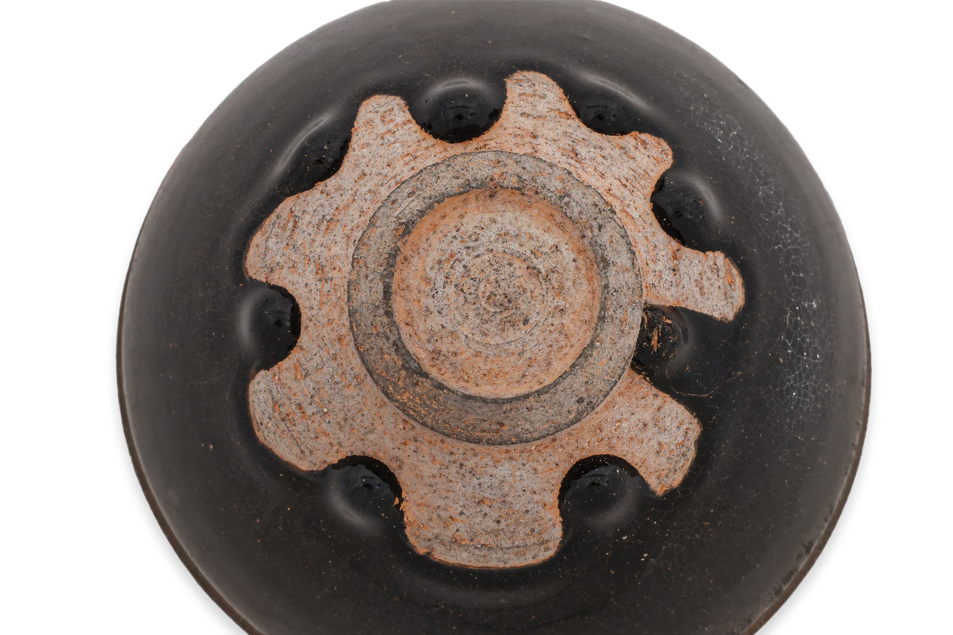 A BLACK GLAZED STONEWARE BOWL